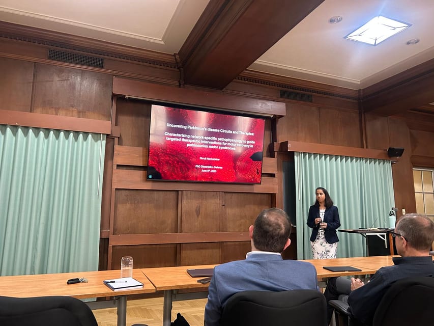 Shruti presenting her PhD dissertation defense, June 2025